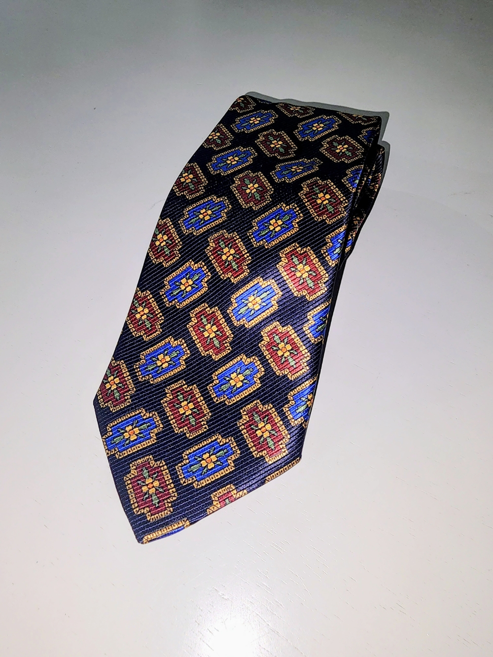 Jos. A. Bank Navy Silk Tie with Gold, Red, Blue & Green Geometric Motif - Picture 2 of 3